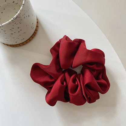 SatinÉclat™ Elegantes Seidengummiband für das Haar